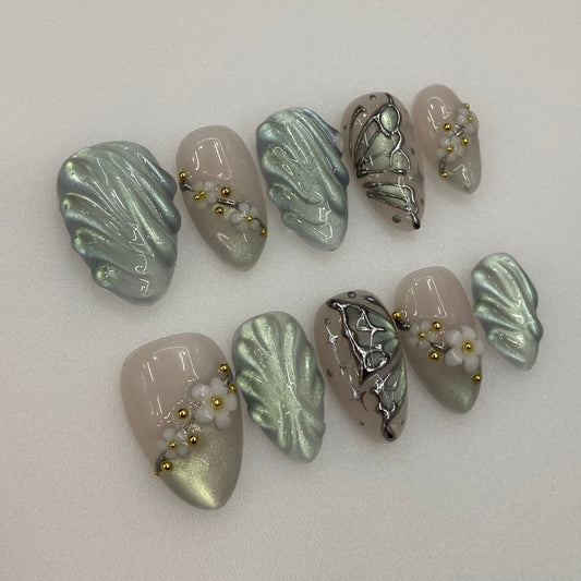 Mermaidcore green press-on nails flat lay | Mermaidcore nail inspo