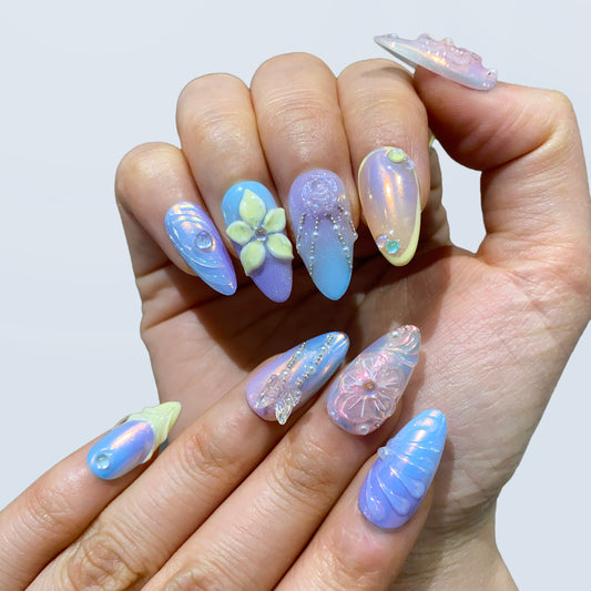 Shimmering purple magnetic cat eye and chrome glaze nails on hand | Y2K galaxy nail inspo