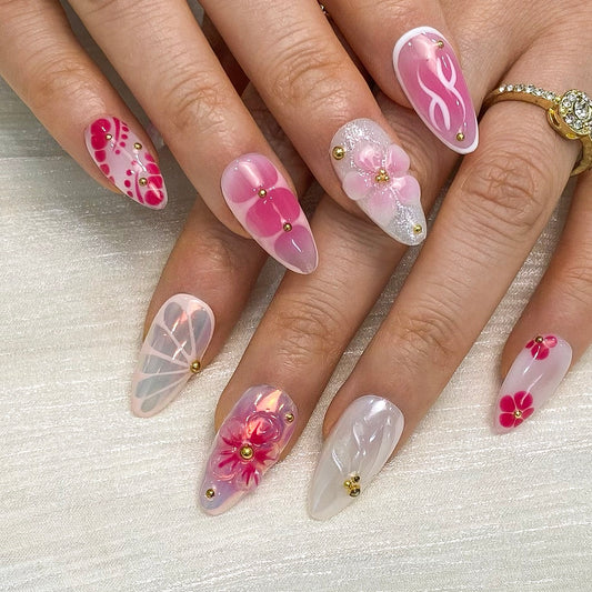 Vibrant cherry red 3D floral petal press-on nails on hand | Cute flower nail inspo