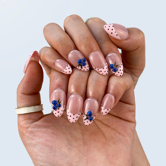 Coquette red press-on nails on hand | Coquette nail inspo