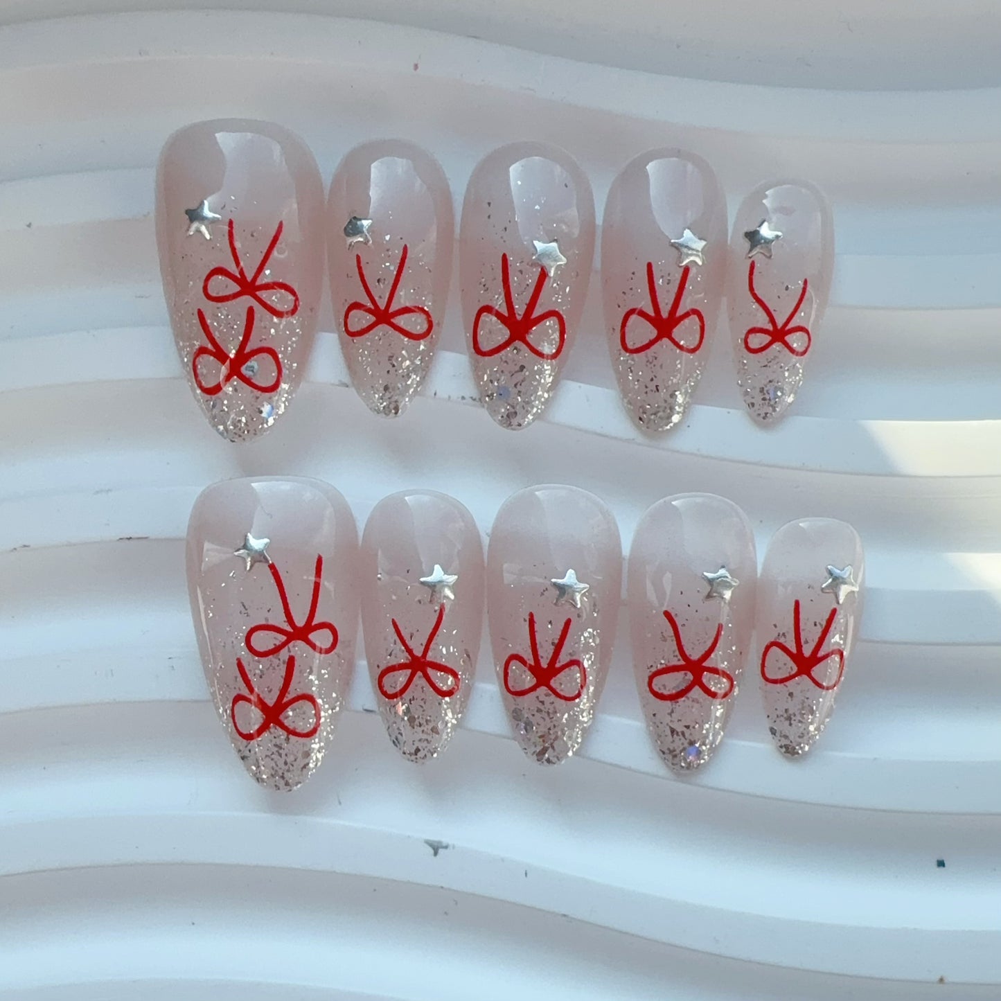 Almond shape cat eye red bow nail