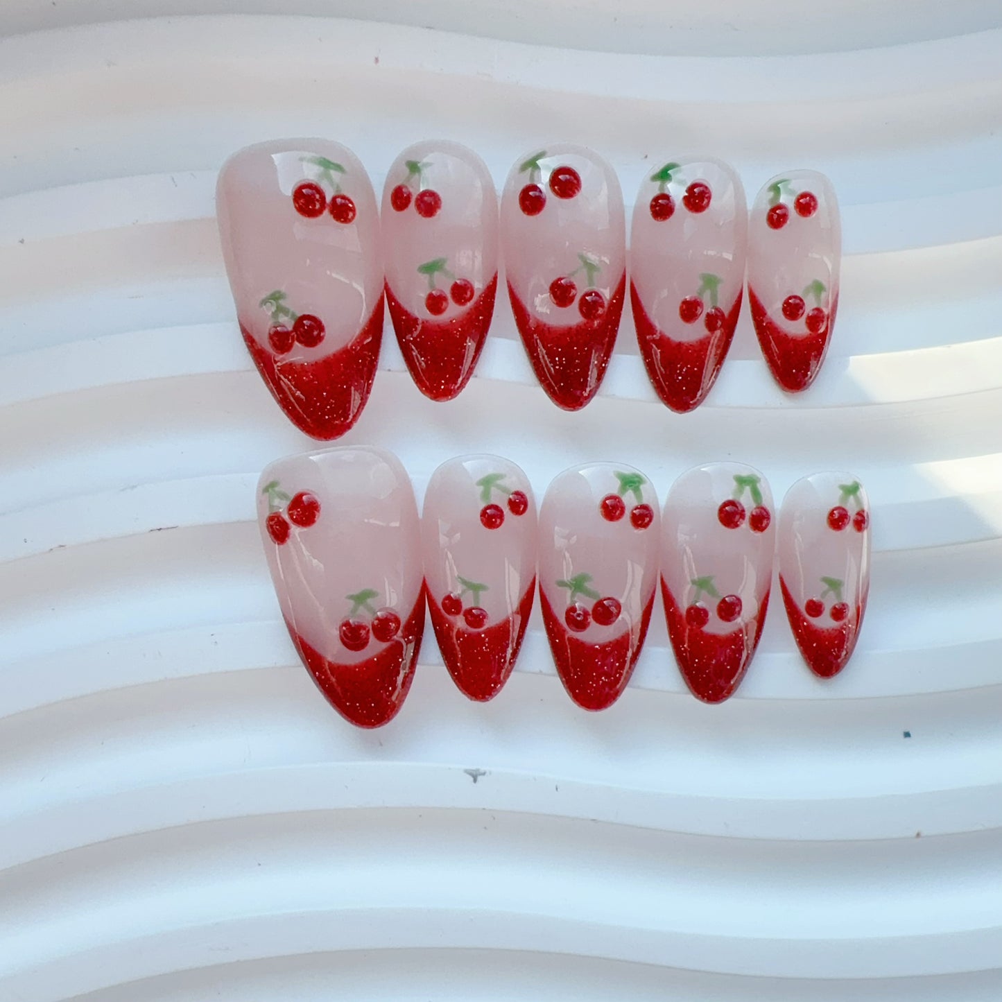 Almond shape cat eye res white cherry nail