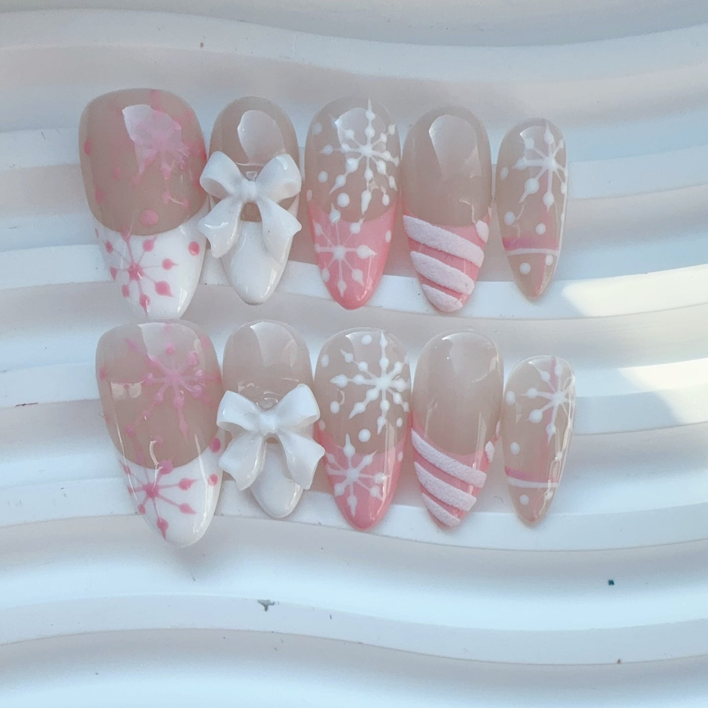 Almond shape pink french snowflake nail