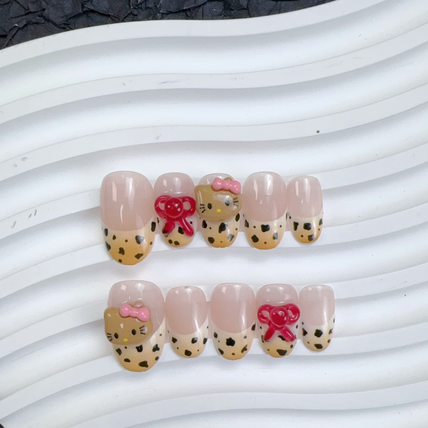 Medium oval leopard print hellokitty nail