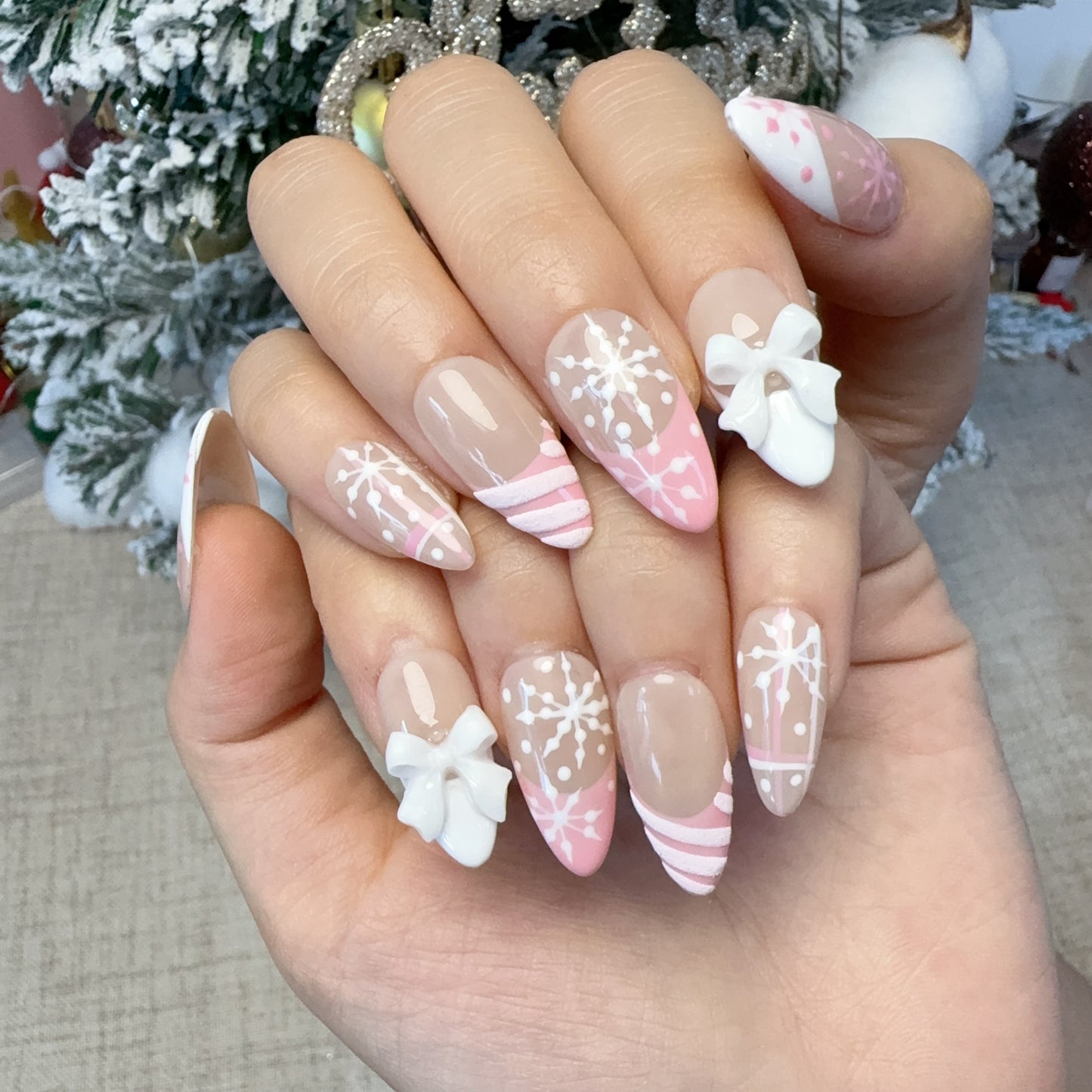 Almond shape pink french snowflake nail