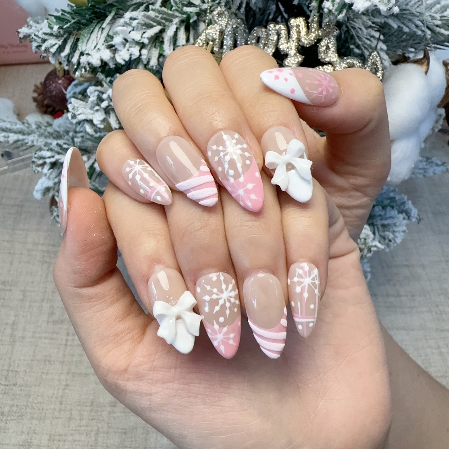 Almond shape pink french snowflake nail