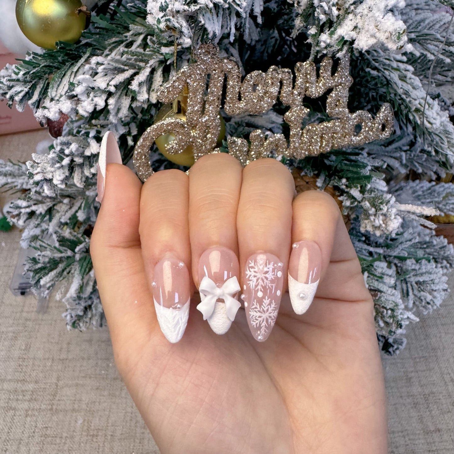 Almond shape white french tip snowflake nail