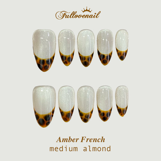 Amber French handmade press-on nails — medium almond set in gold and clean French smile lines | Fullovenail