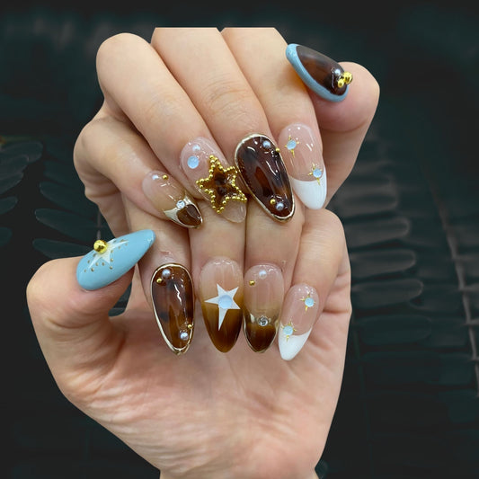 Celestial white press-on nails on hand | Celestial nail inspo