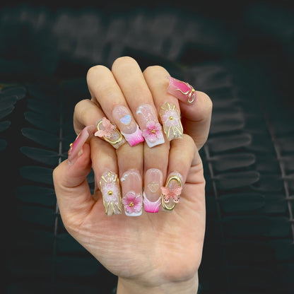 Full set wear display of Ribbon Dream balletcore square nails on dark backdrop
