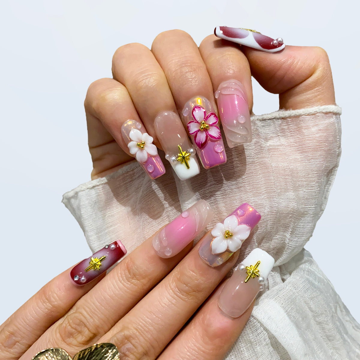Blossom Fairy medium square nails shown with sheer sleeves and 3D floral crafts