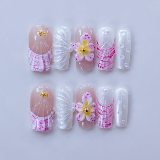 Mermaidcore white press-on nails flat lay | Mermaidcore nail inspo