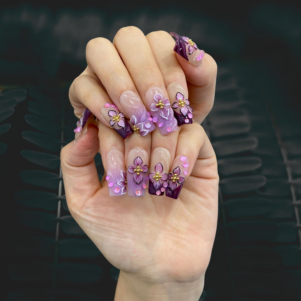 Full set wear display of Midnight Blooms moody purple floral square press-ons