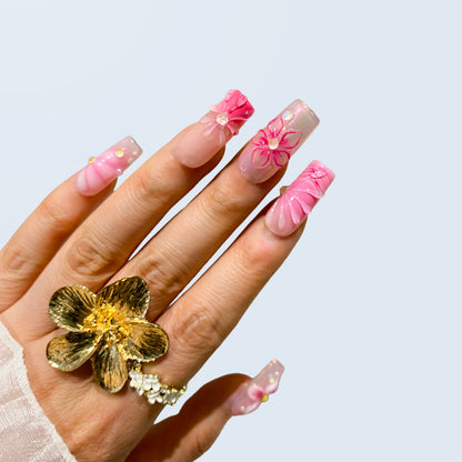 Single hand view of Blush Bloom Spark nails displaying raised shell ridges