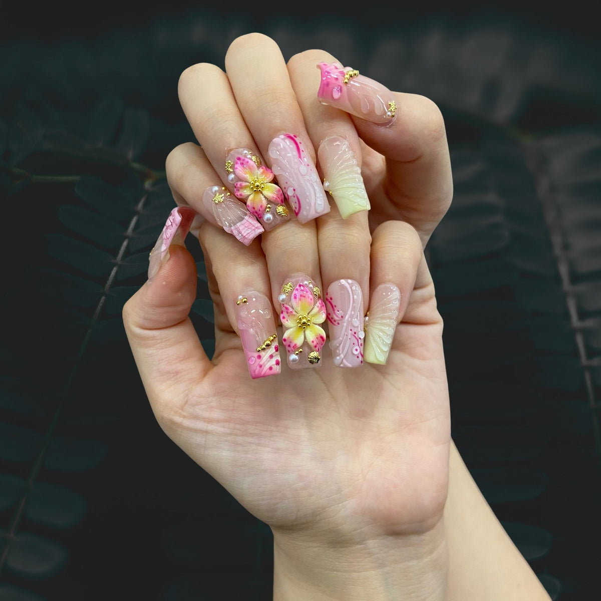 Pastel Petal Charm medium square press-on nails shown on hand in indoor lighting