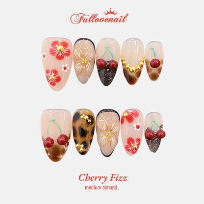 Cherry Fizz handmade press-on nails — medium almond set in red and handcrafted art detailing | Fullovenail