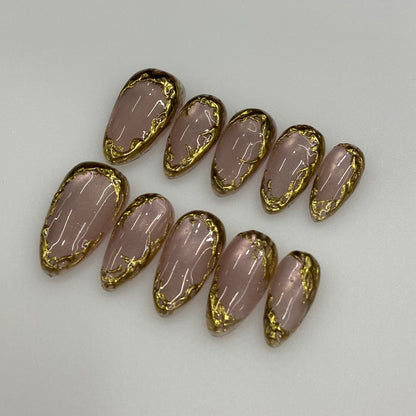 Full 10-piece set display of Gilded Nude champagne velvet cat-eye press-on nails