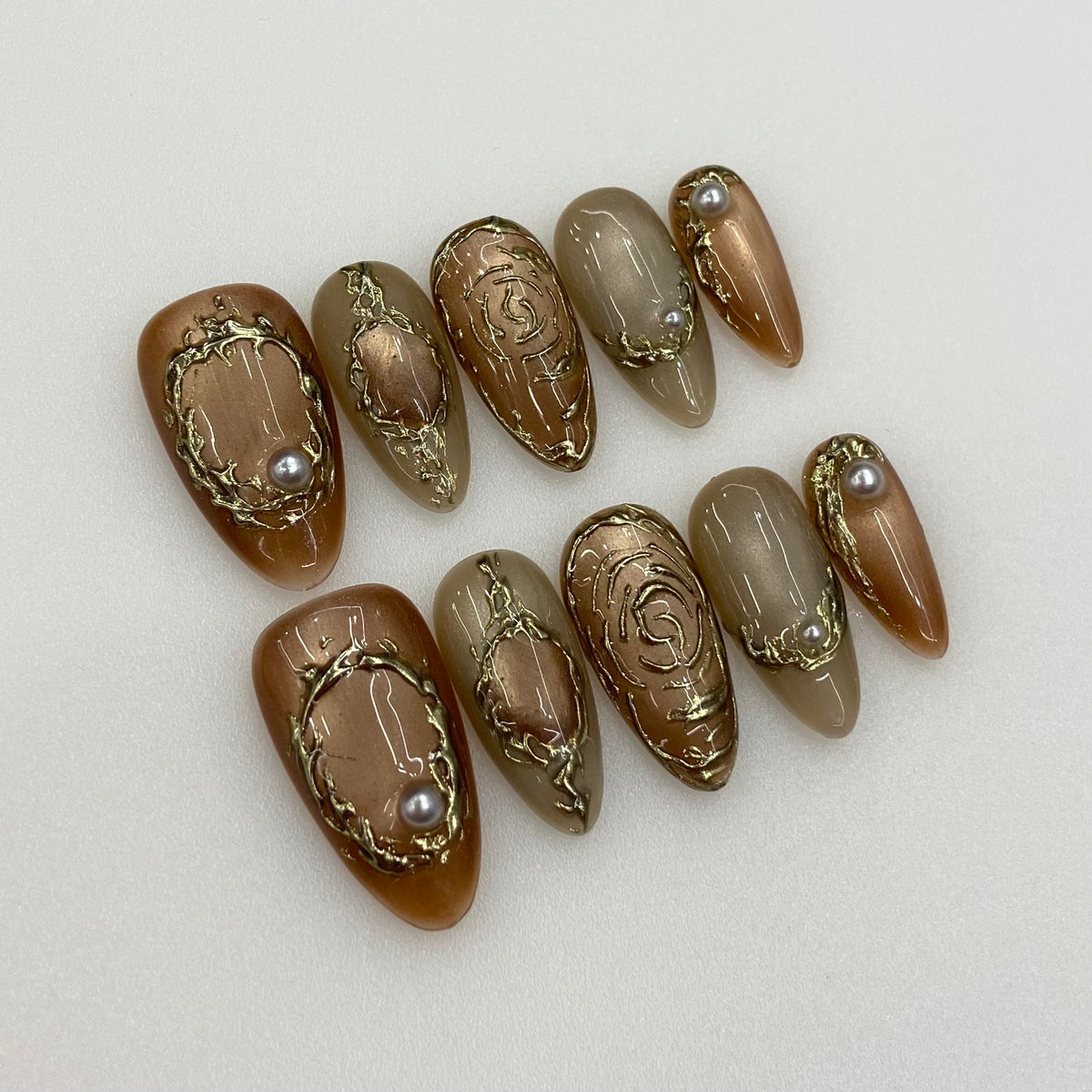 Full 10-piece set of Golden Drift nails with warm amber velvet cat-eye glow