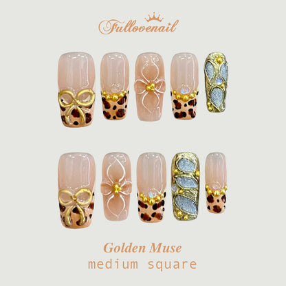 Golden Muse square press-on nails with 3D metallic bow and leopard French tips