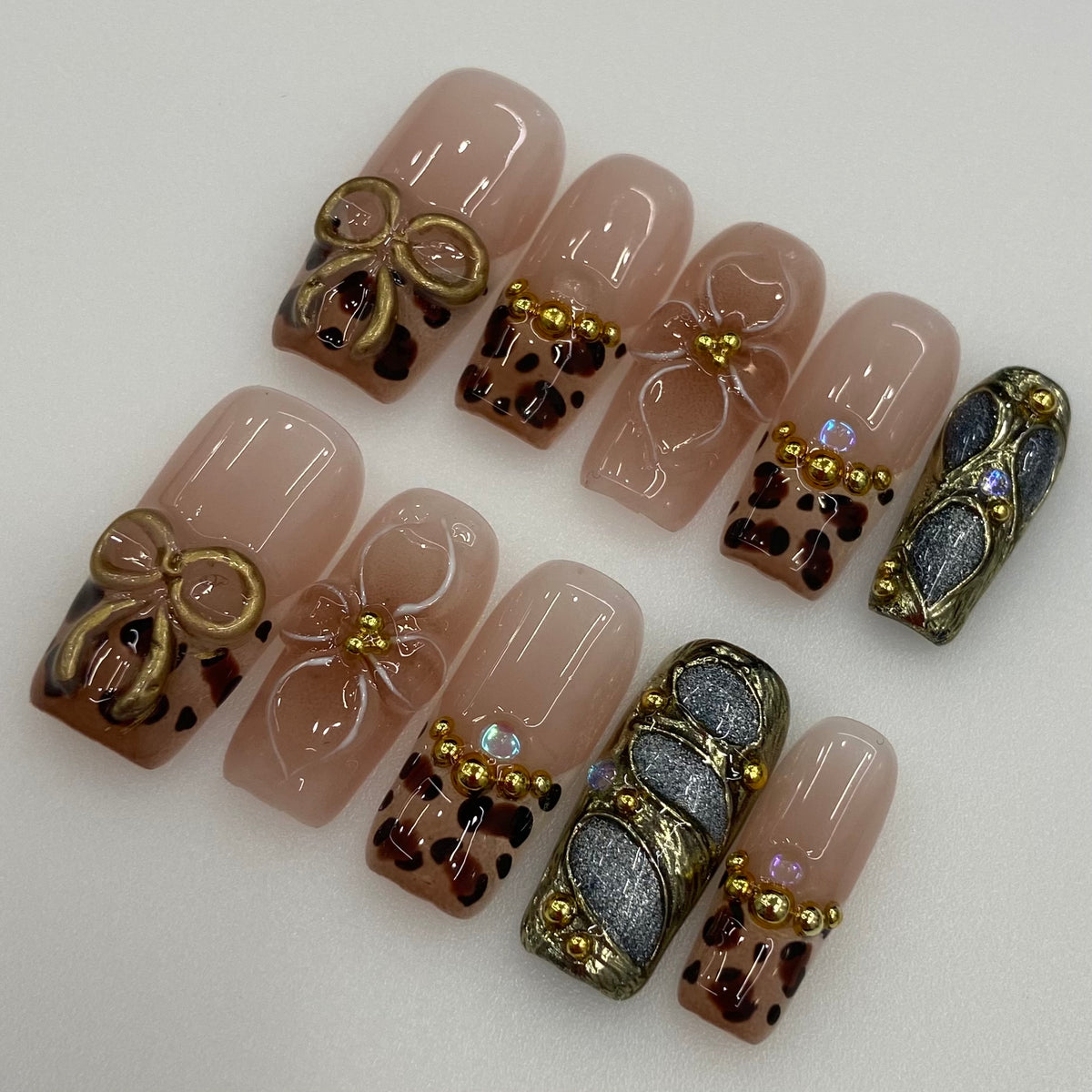 Full 10-piece set display of Golden Muse leopard French square press-on nails
