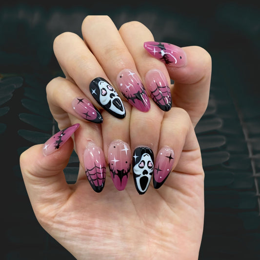 Dark masquerade gothic gel press-on nails on hand | Halloween aesthetic nail inspo