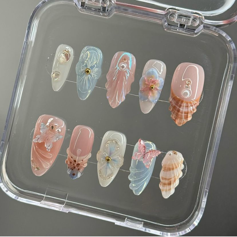 Clear display case photo of Mermaid's Bloom iridescent pastel press-on nails