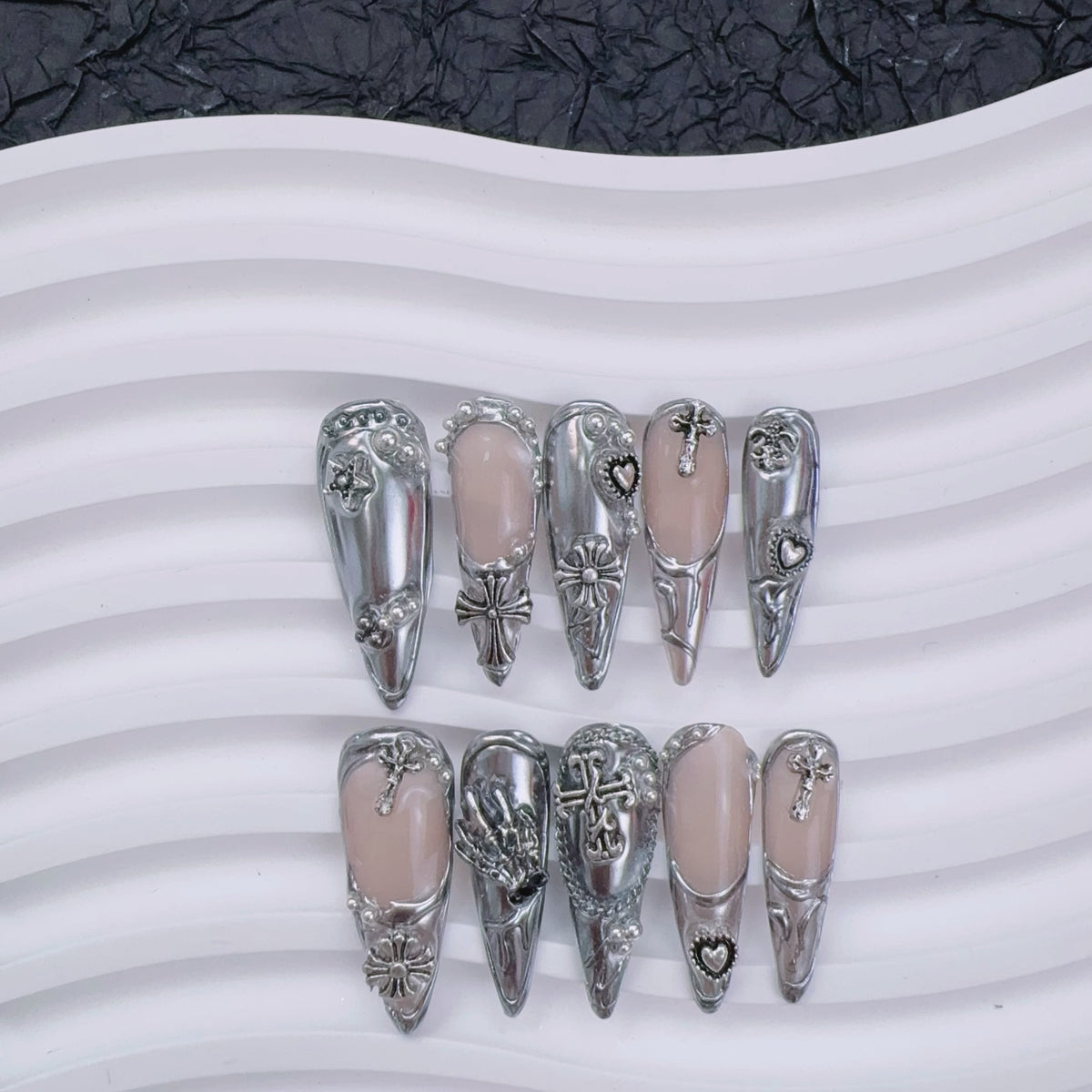 Gothic silver press-on nails flat lay | Gothic nail inspo