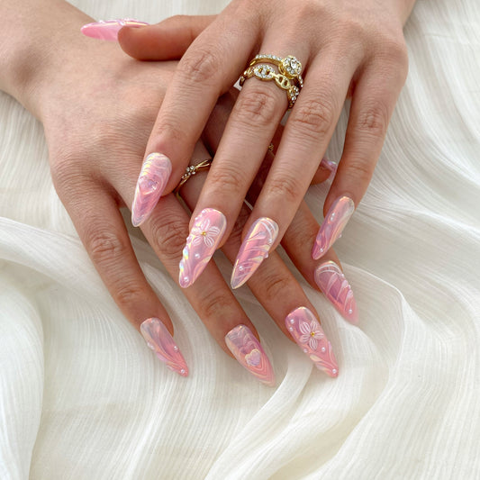 On-hand try-on of Blossom Wishes nails showing pink and baby blue watercolor ombre