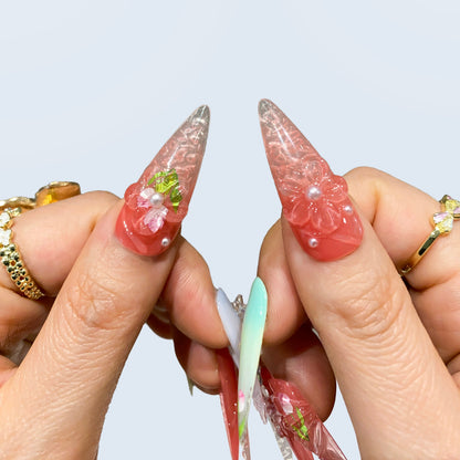 humbs closeup of Blush Bloom nails showing 3D sculpted tulips and dewdrop pearls