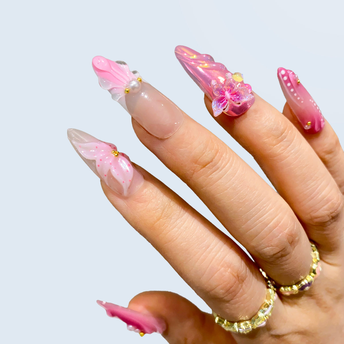 Close-up angle of Butterfly Kisses nails highlighting 3D butterfly charm and gems