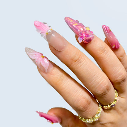 Close-up angle of Butterfly Kisses nails highlighting 3D butterfly charm and gems