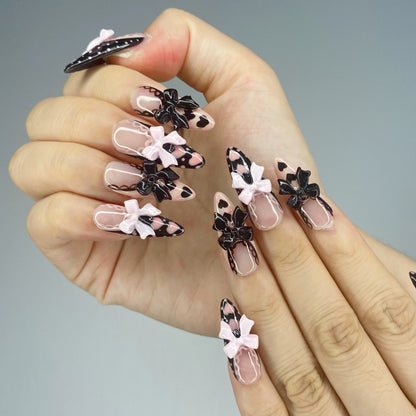 Close-up view of Gothic Doll nails highlighting dramatic black lace French borders