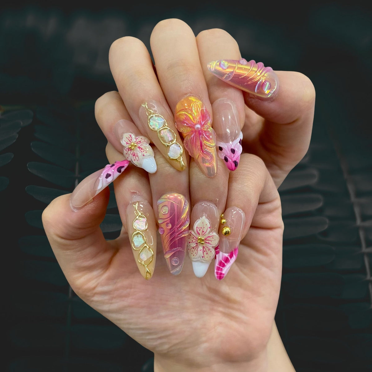 Both hands wearing Art Deco Bloom high-glamour ombre stiletto press-on nails