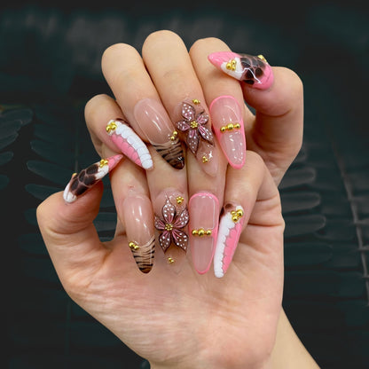 Wear display of Latte Bisou stiletto press-on nails in indoor lighting on hand