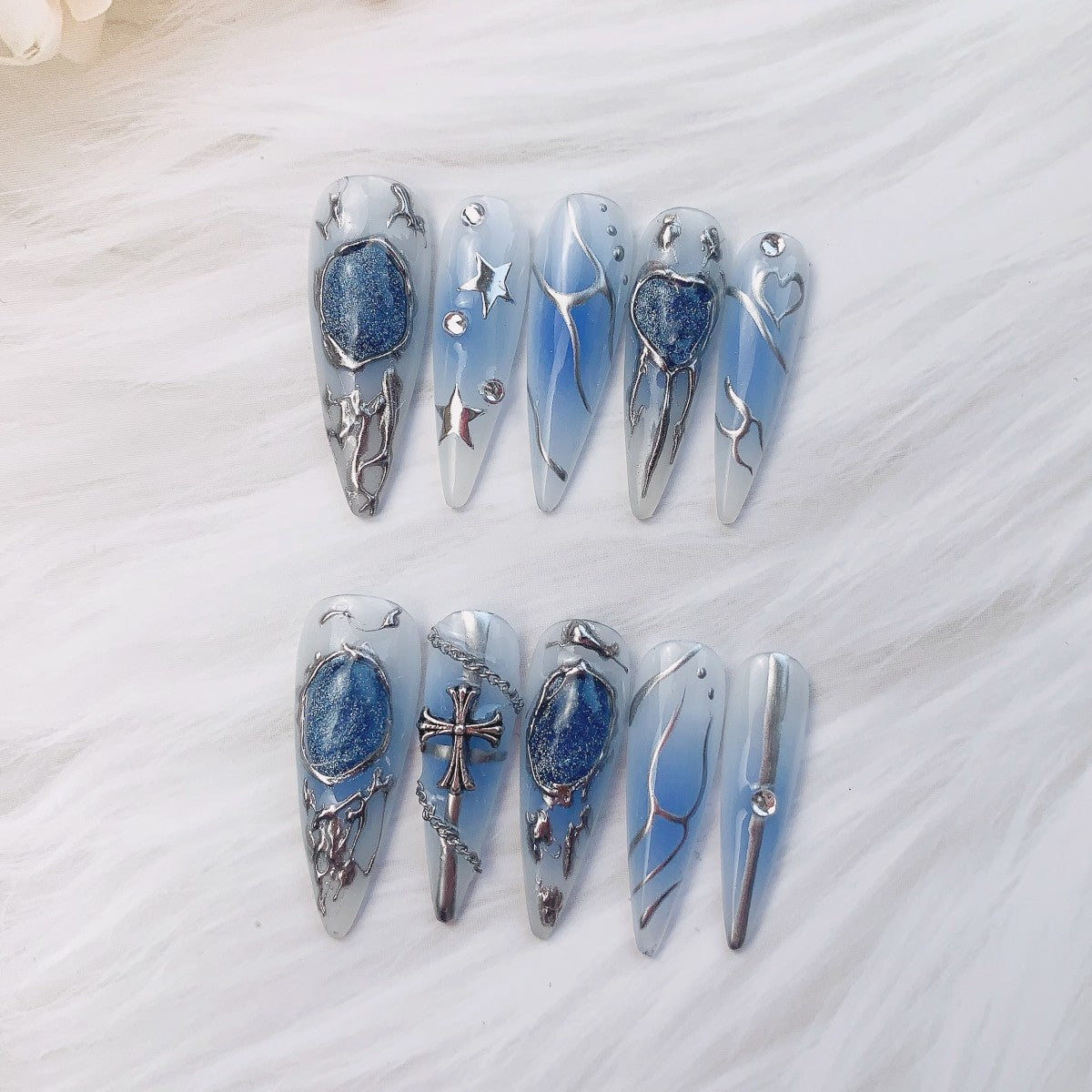 Luxury gothic celestial gel press-on nails with custom sizing close up | shown flat lay