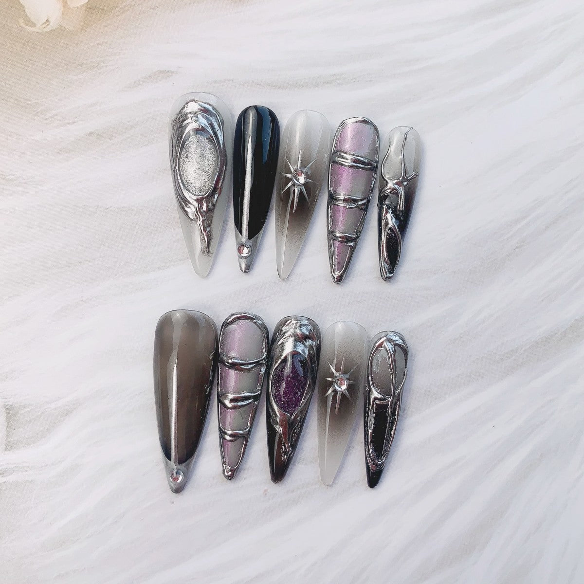 Celestial aurora lilac press-on nails flat lay | Celestial nail inspo