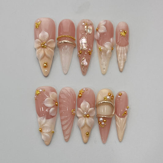 Mermaidcore ocean aqua press-on nails on table | Mermaidcore nail inspo