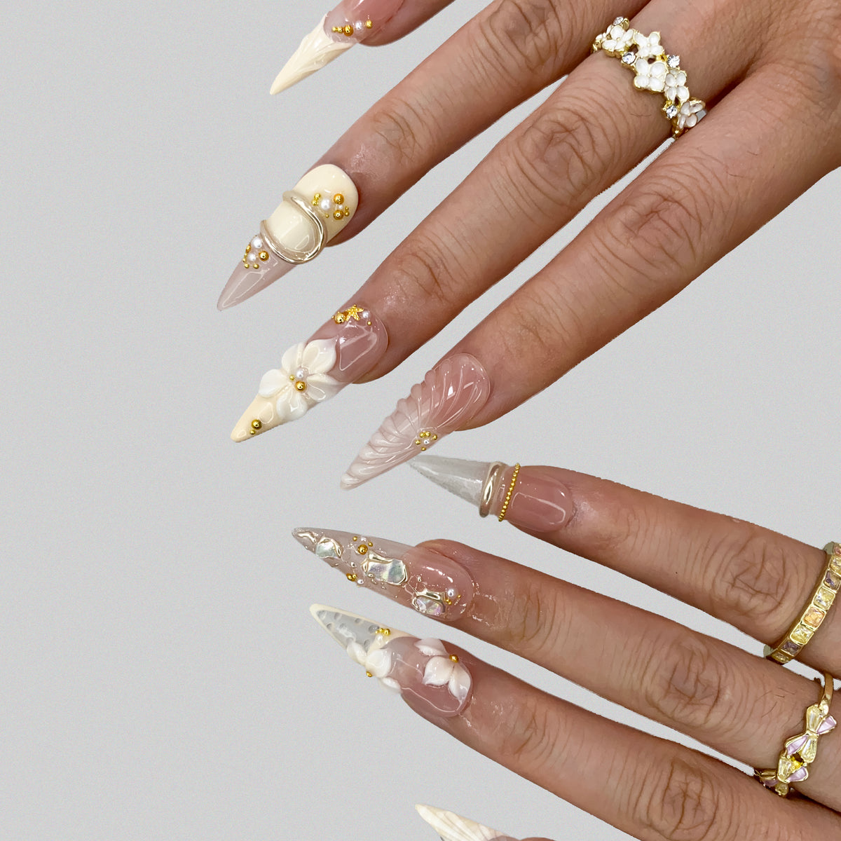 Extended finger view displaying flattering stiletto shape of Ethereal Shell nails