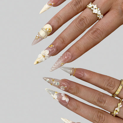 Extended finger view displaying flattering stiletto shape of Ethereal Shell nails