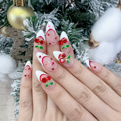 On-hand try-on of Velvet Cherry nails showing 3D sculpted cherries and white tips