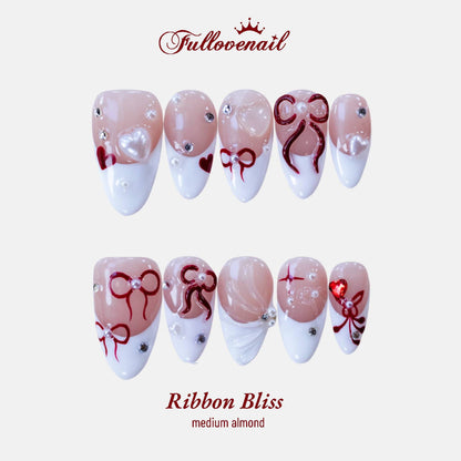 Ribbon Bliss almond press-on nails with 3D red bows and white French tips