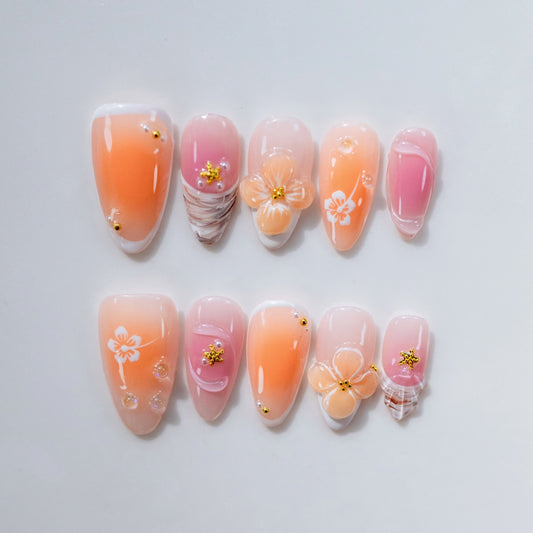 Floral Garden coral orange press-on nails on hand | Floral Garden nail inspo