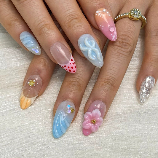 Mermaidcore peach coral press-on nails on hand | Summer coastal nail inspo