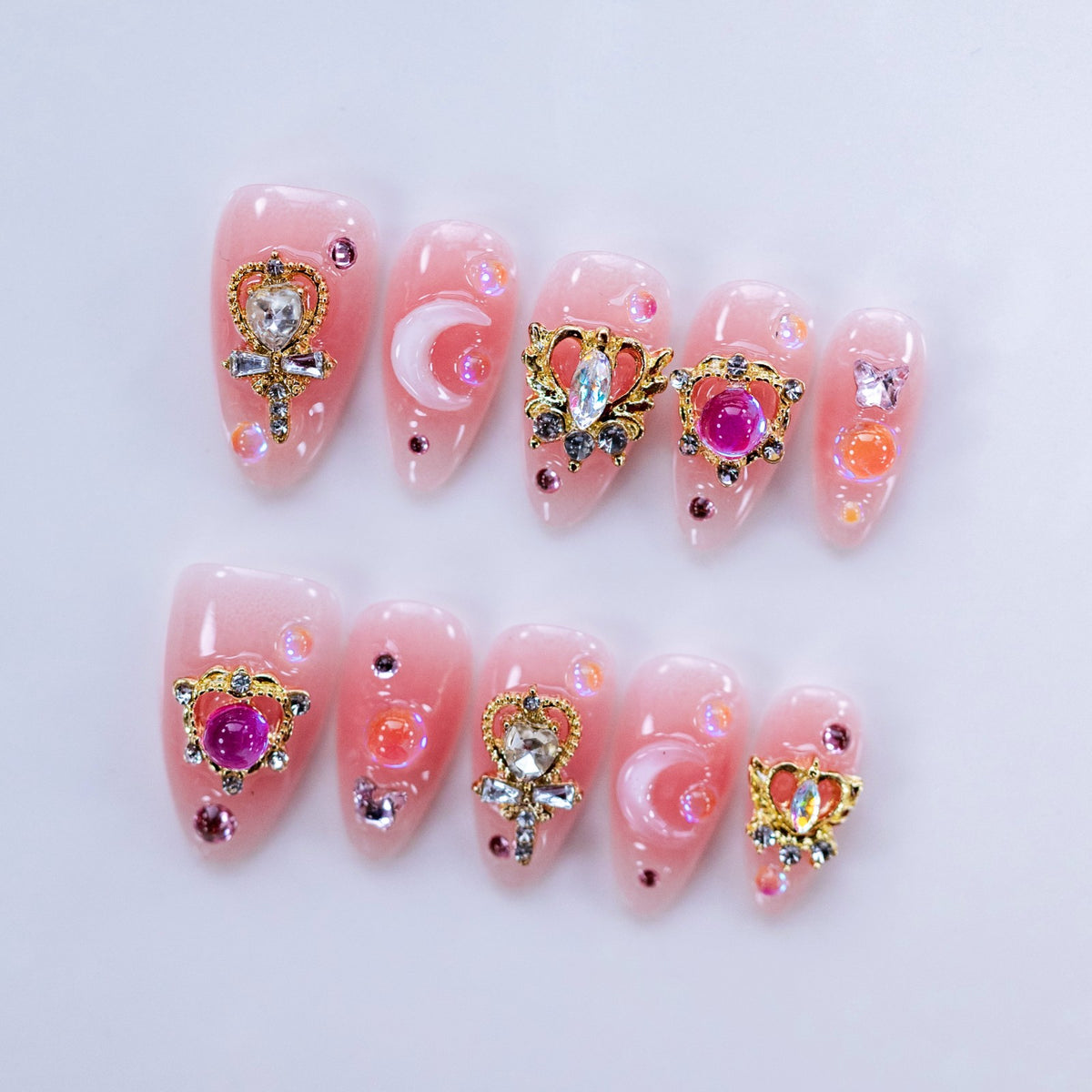 Flat lay photo of Moonlight Princess nails displaying 3D scepters and crescent moons
