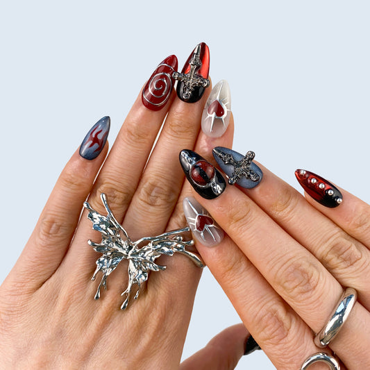 Gothic black press-on nails on hand | Gothic nail inspo