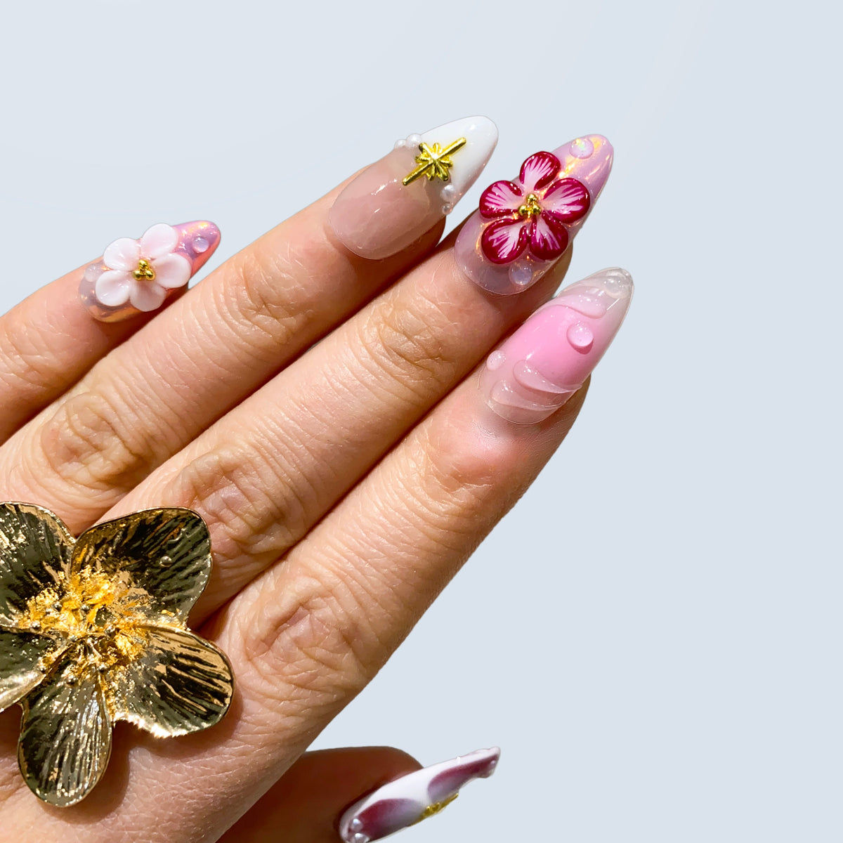 Side view of Celestial Blossom Fairy nails displaying raised 3D petals and stars