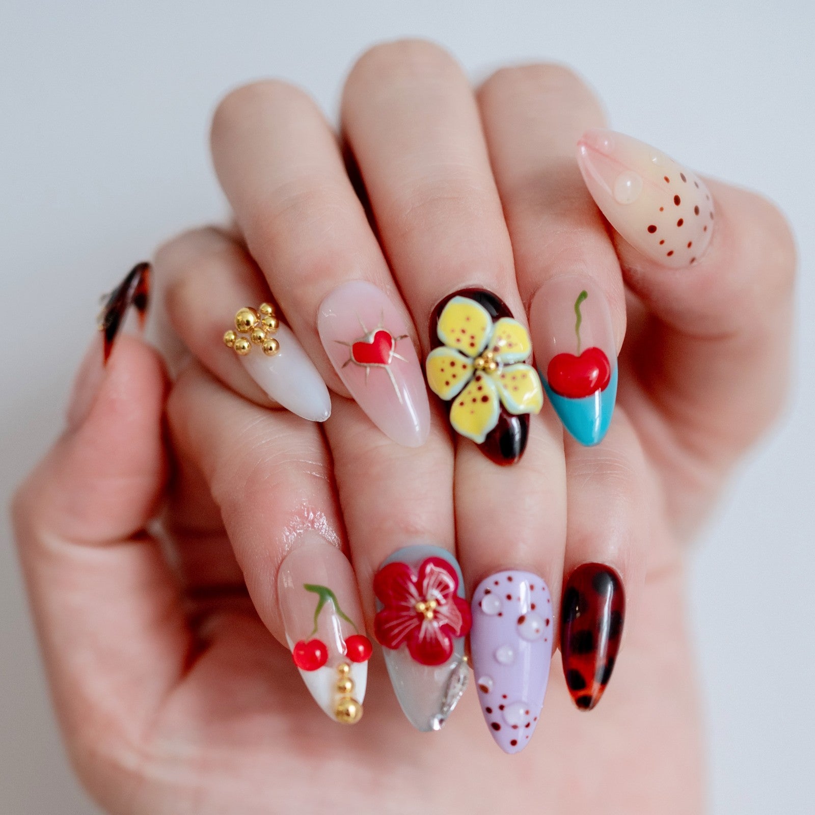 Floral Garden floral pink press-on nails on hand | Floral Garden nail inspo