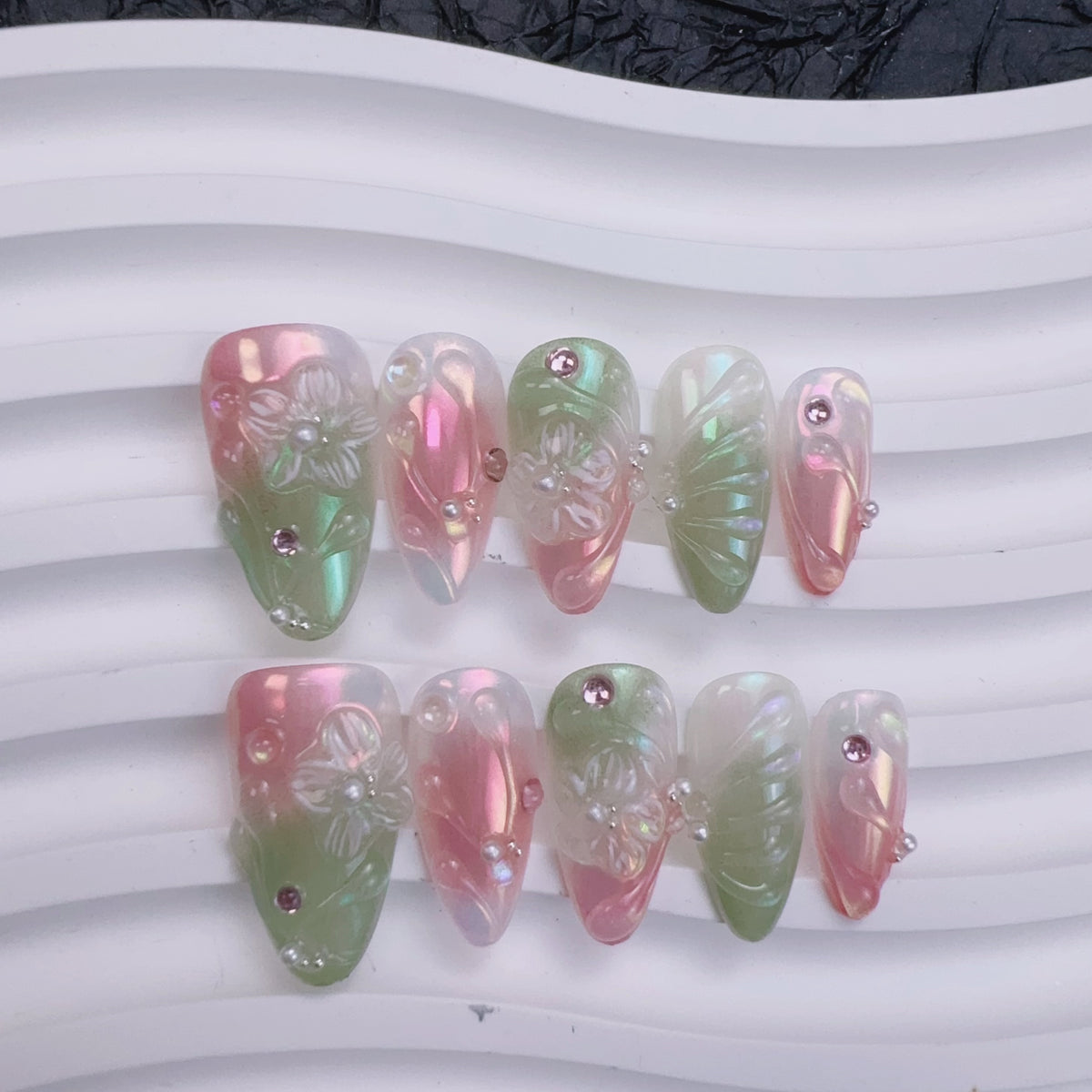 Ceramic tray flat lay of Ocean's Bloom nails showing 3D floral and seashell design