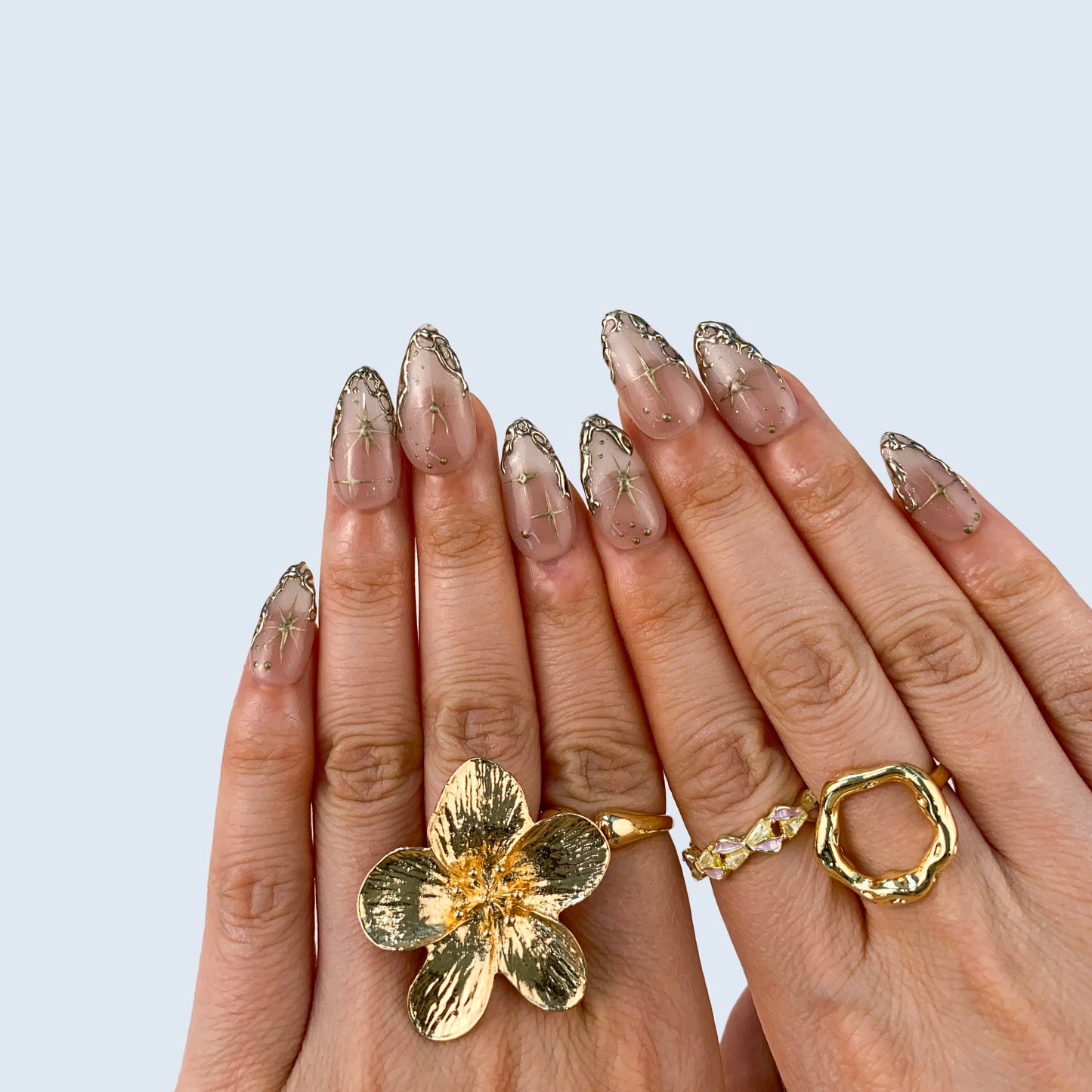 Handcrafted gold gel fake nails in natural light for everyday wear and special occasions