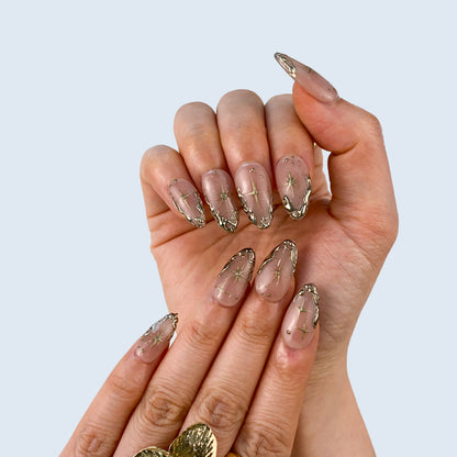 Salon quality Gilded Serenity reusable gel press-on nails with custom sizing on natural hands